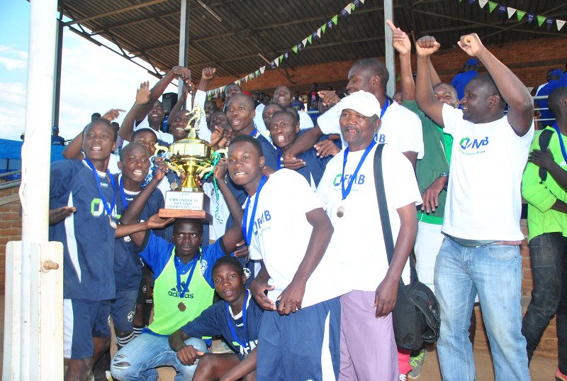 Our Fish Eagles Football team of Mzuzu savouring their 2014 FMB Under-20 Championship win