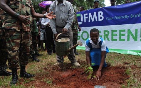 A student participates in the FMB Go Green Campaign at Cobbe Barracks in Zomba