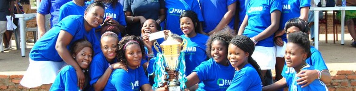 Genetrix Women’s Hockey Team show off their trophy after winning the 2014 Women’s Hockey League’s tournament